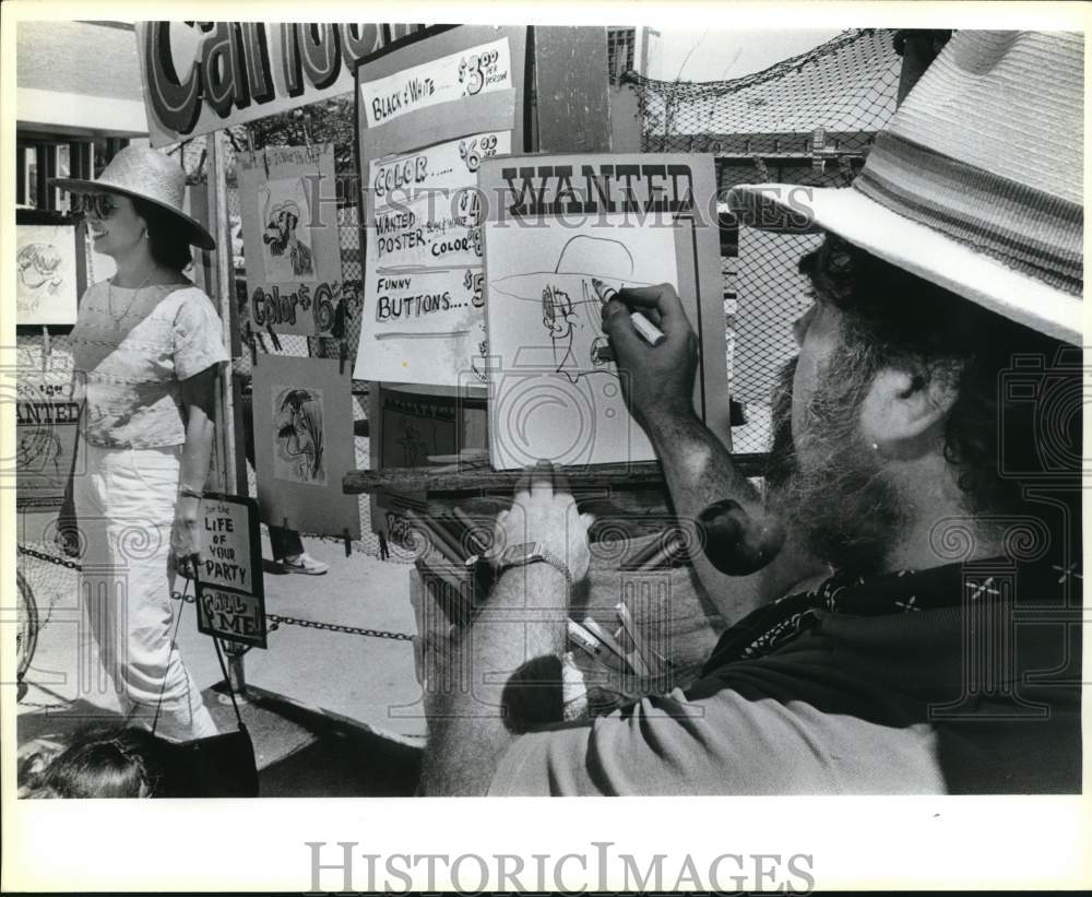 1985 Press Photo Caricaturist at work during the Starving Artist Show- Historic Images