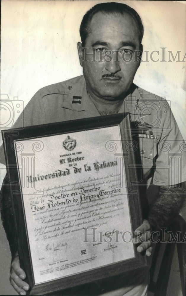 Press Photo Captain Jose Rojas holds his Doctor on Derecho certificate - Historic Images