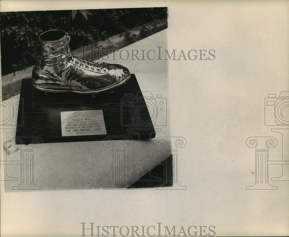 A Thom McCan shoe trophy on display - Historic Images