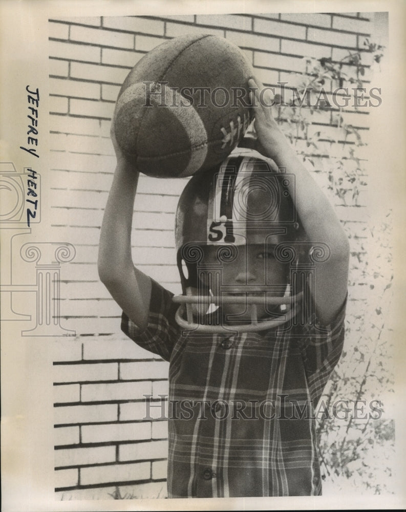 Press Photo Jeffrey Heartz wears football gear and holds a football - sba15001-Historic Images