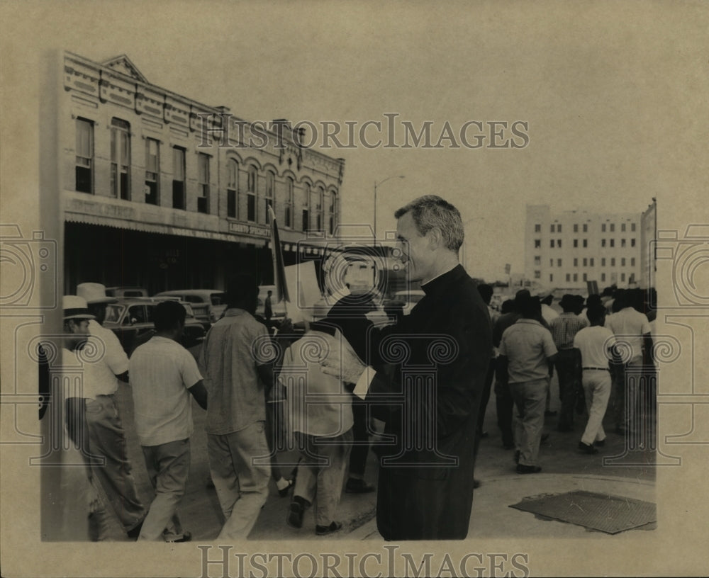 Press Photo Father Sherrill Smith and men walking on a street - sba16535-Historic Images
