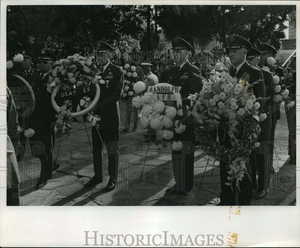 Press Photo Military officers hold flowers to offer - sba16795-Historic Images