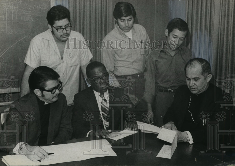 Press Photo Catholic Bishop P. F. Flores  reads a letter as his supporter look - Historic Images