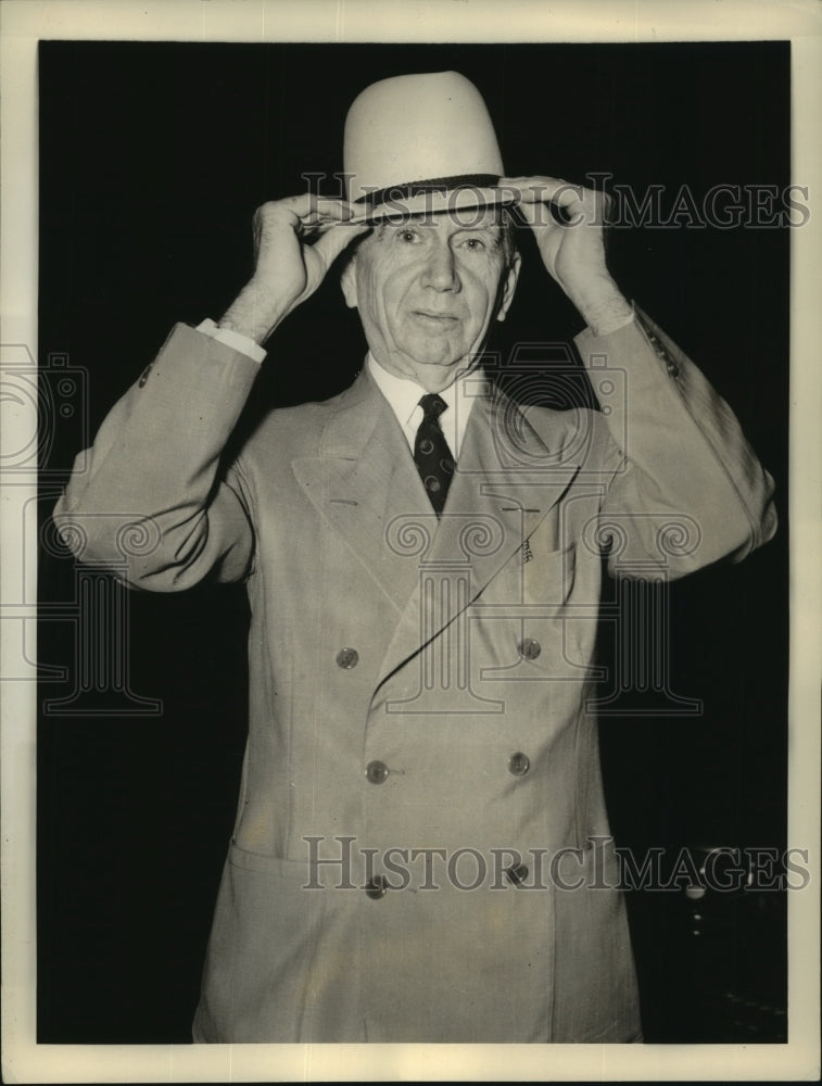 1938 Secretary of Commerce Daniel C. Roper tires a fashionable hat - Historic Images