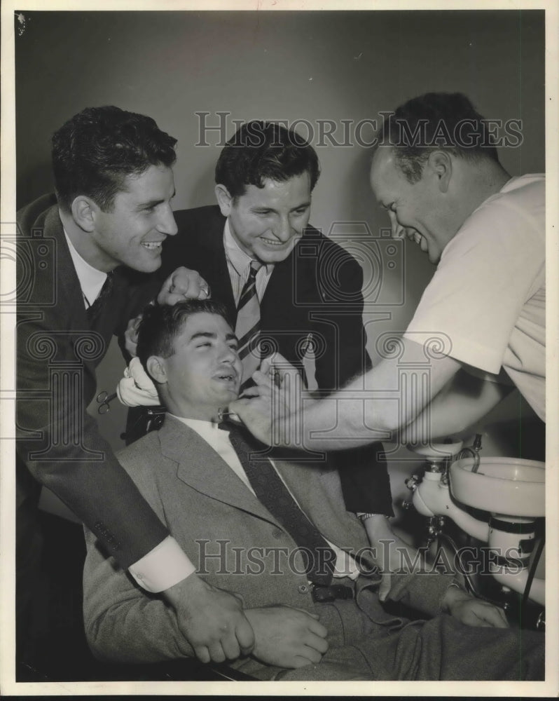 Press Photo Mr Daniel in dentist's chair surrounded by other men - Historic Images
