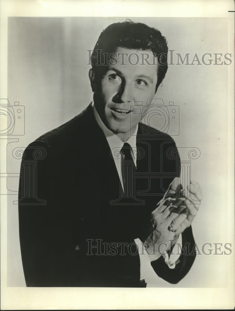 American actor and singer John Raitt posing for a photograph - Historic Images