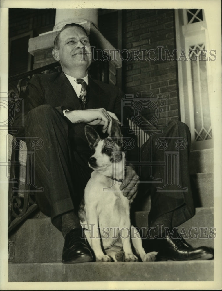 1939 Representative Martin Dies shown at home with his dog Lady - Historic Images