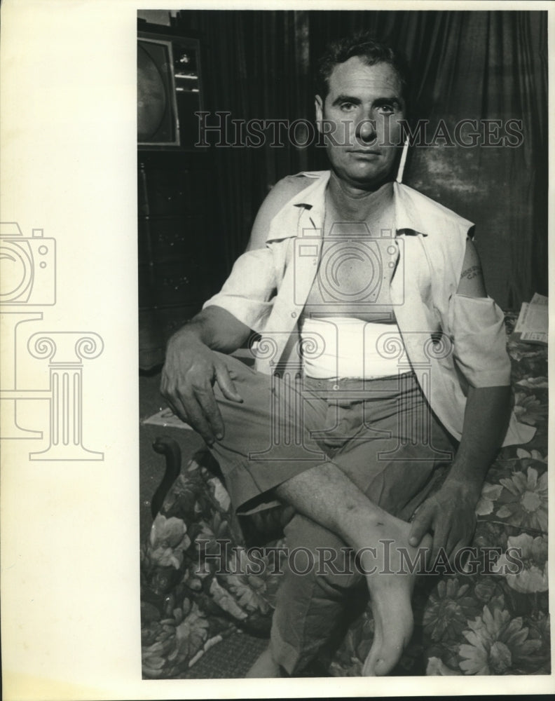 Press Photo Jon Singleton, businessman shown with his ripped clothes-Historic Images