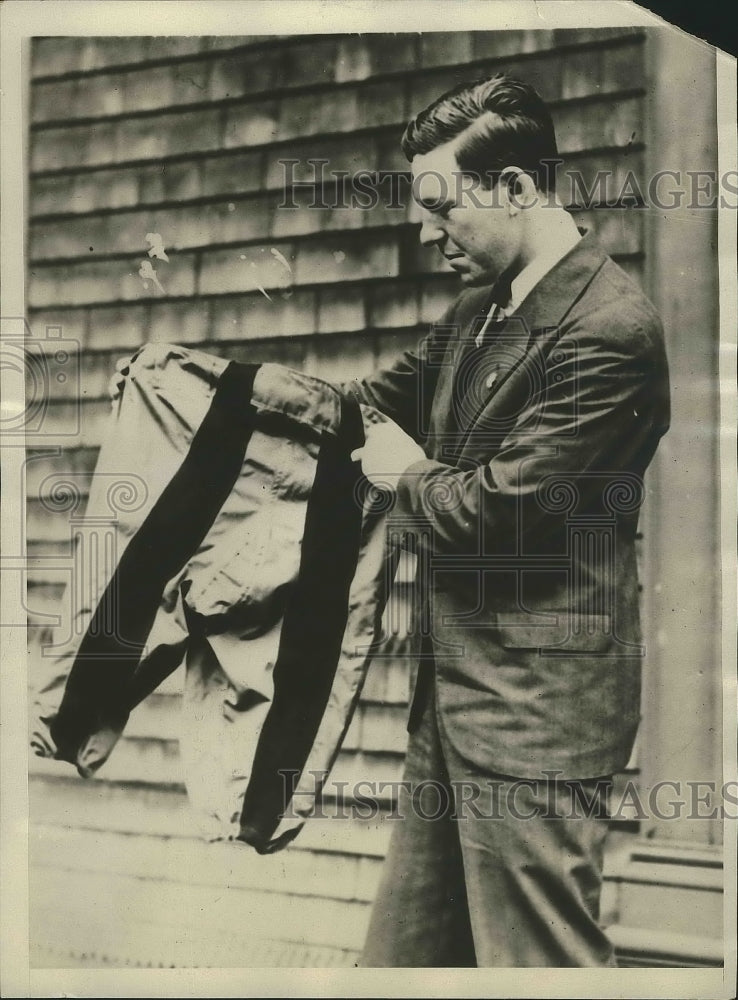 1929 Press Photo Jim Barrett looking for rips in his football togs - sbs00819- Historic Images