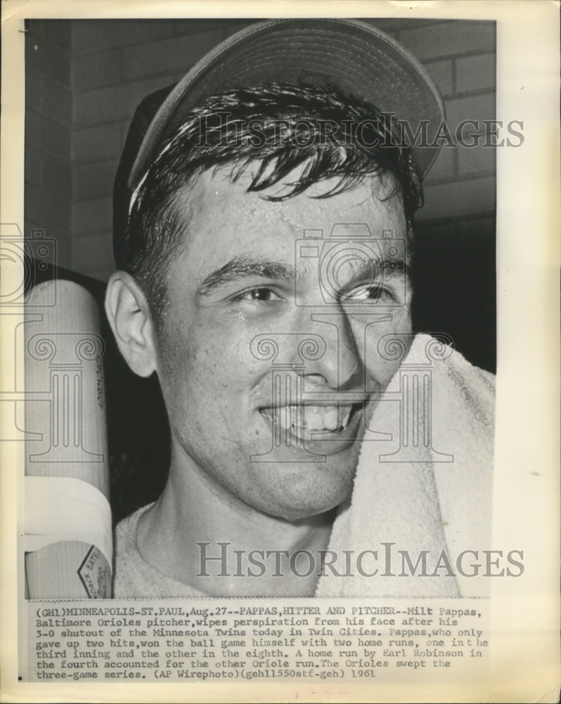 1961 Press Photo Milt Pappas wipes perspiration from his face - sbs07825 - Historic Images