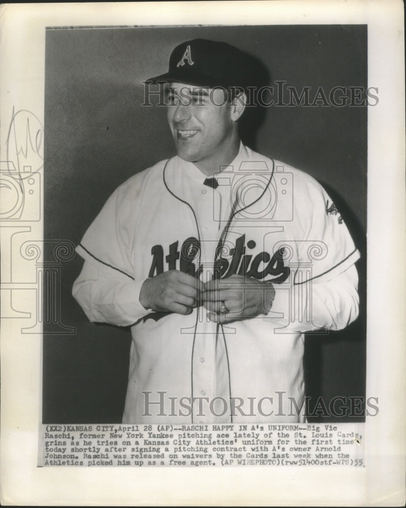 1955 Press Photo Big Vic Raschi Ace Pitcher, tries on a Kansas City Athletics. - Historic Images