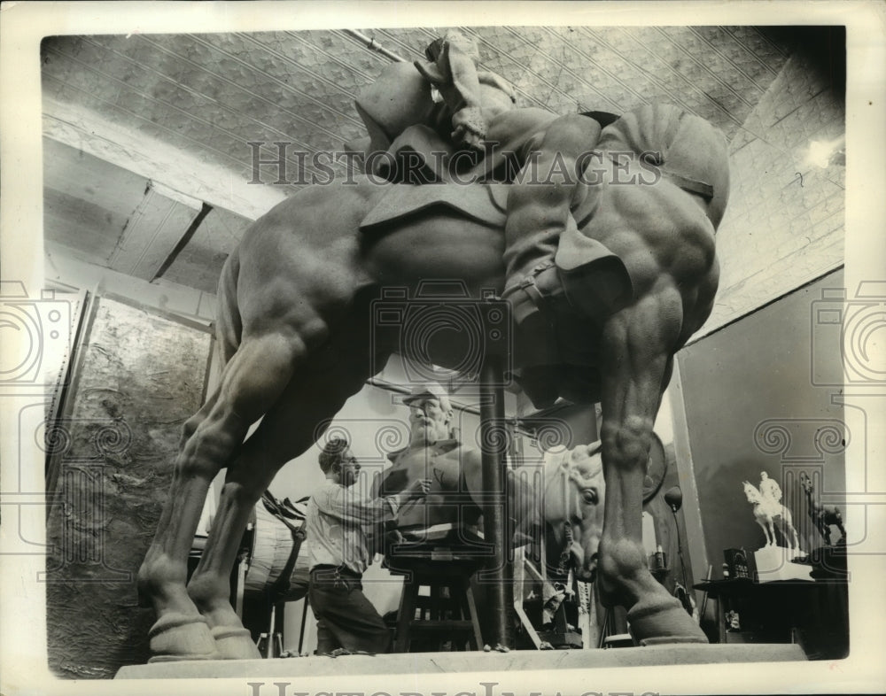Sculptor Joseph P. Pollia  work on the statue of Stonewall-Historic Images