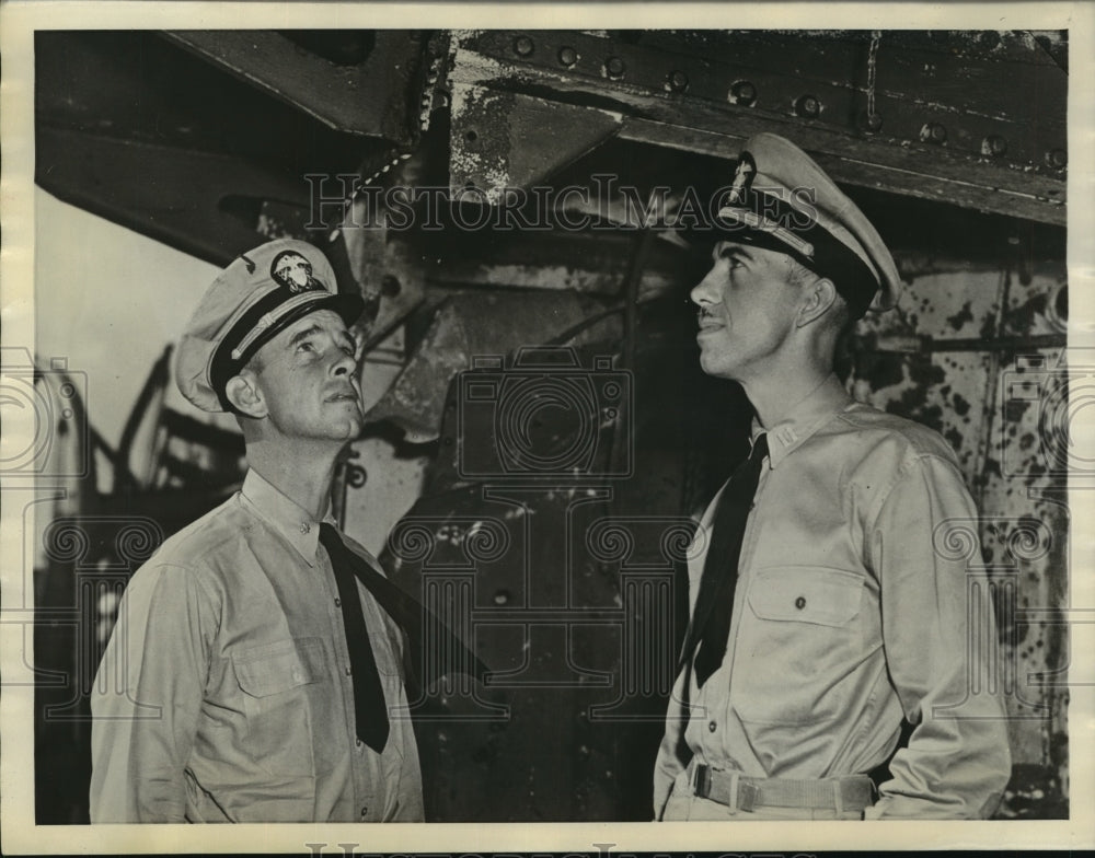 1943 Lt. Alderman, Lt. Gardner inspect section of their ship - Historic Images