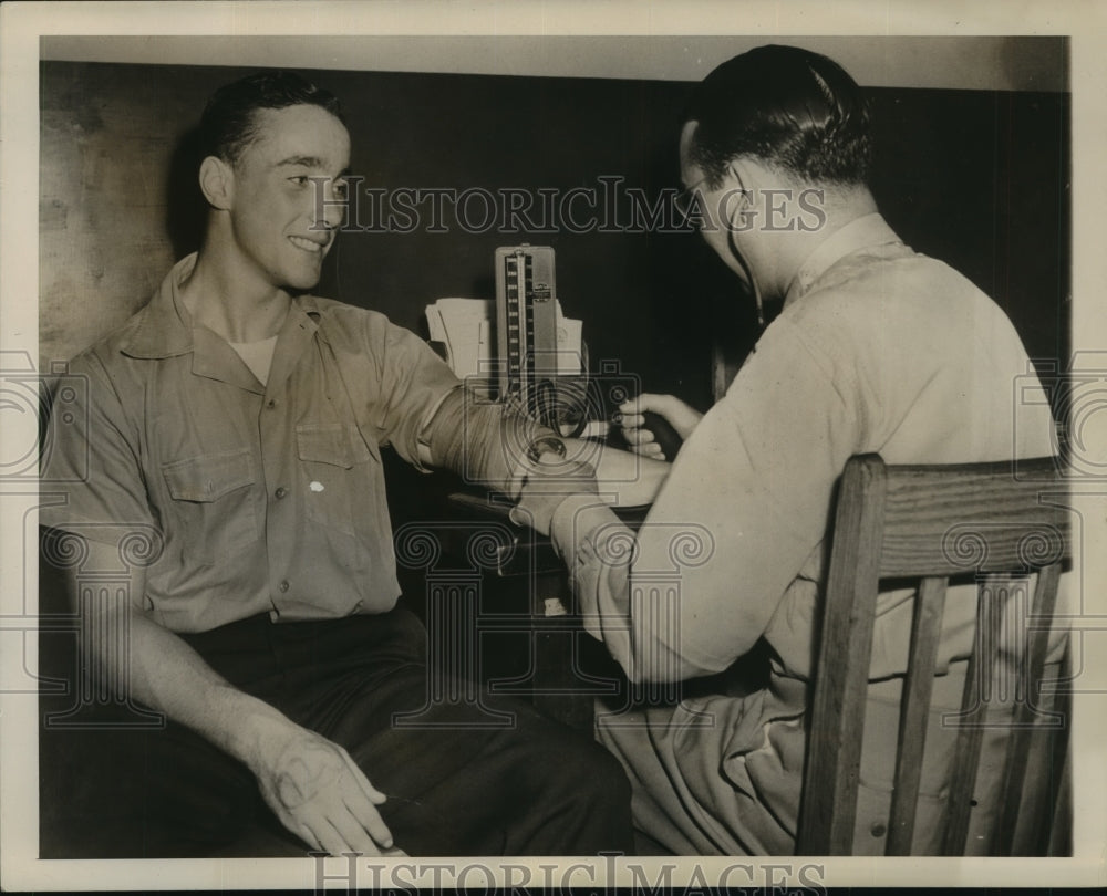 1944 Press Photo Charles A. Comiskey II has his blood pressure taken-Historic Images