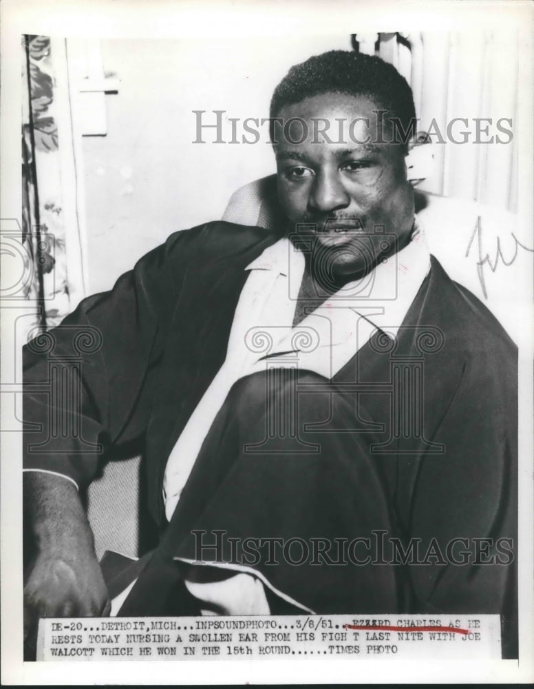 1951 Press Photo Boxer Ezzard Charles Nurses Swollen Ear from Fight - sbx13397- Historic Images