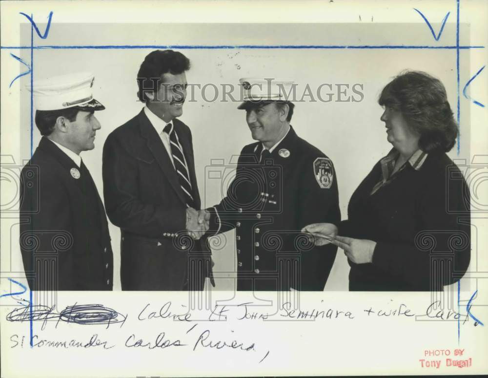 1984 Press Photo Advance City Editor Brian J. Laline congratulates firemen - Historic Images