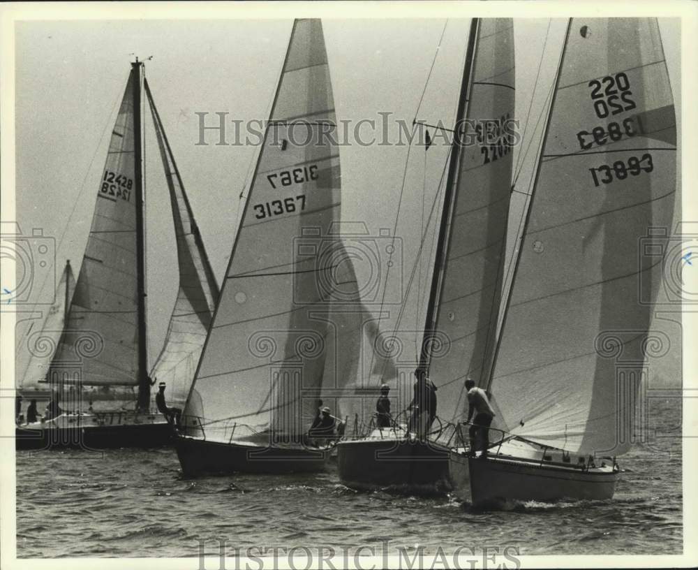 1983 Press Photo A line of sailboats on the water - sia03907 - Historic Images