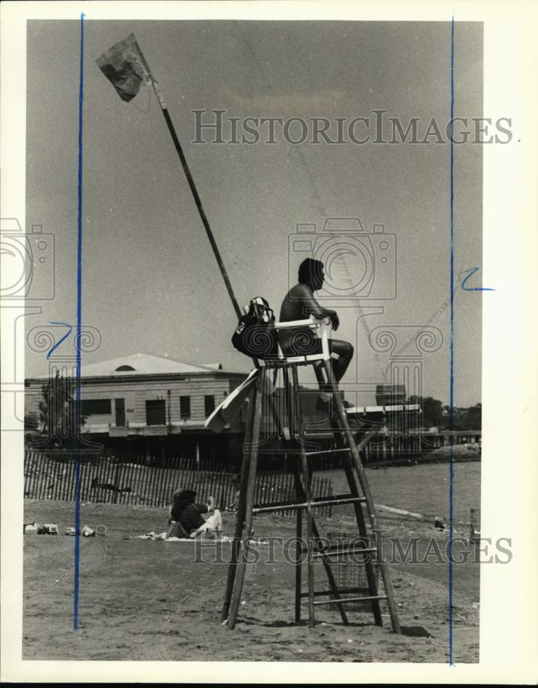 1988 Press Photo Lifeguard on watch at a beach - sia09460 - Historic Images