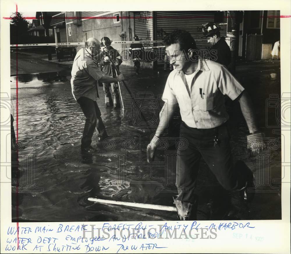 1992 Firefighters shutting off broken water main in Mariners Harbor - Historic Images