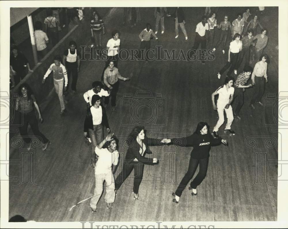 1980 Press Photo Roller skaters skating on a rink - sia11481 - Historic Images