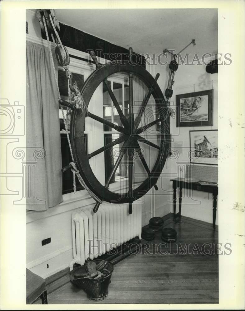 1986 John Noble ship&#39;s wheel on display-Historic Images