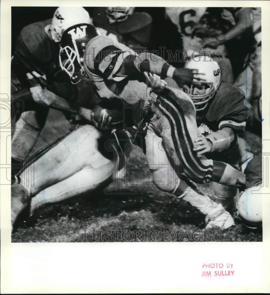 Press Photo Wagner Football Player at Game Tackle - Historic Images
