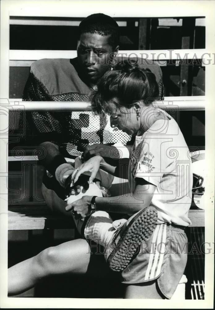 Press Photo Wagner football player gets wrap for his knee after fall on field- Historic Images
