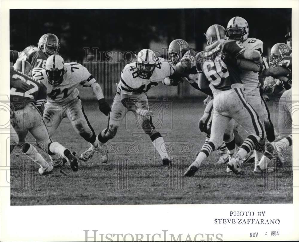 1984 Press Photo Wagner and Hofstra football players crash together during game - Historic Images