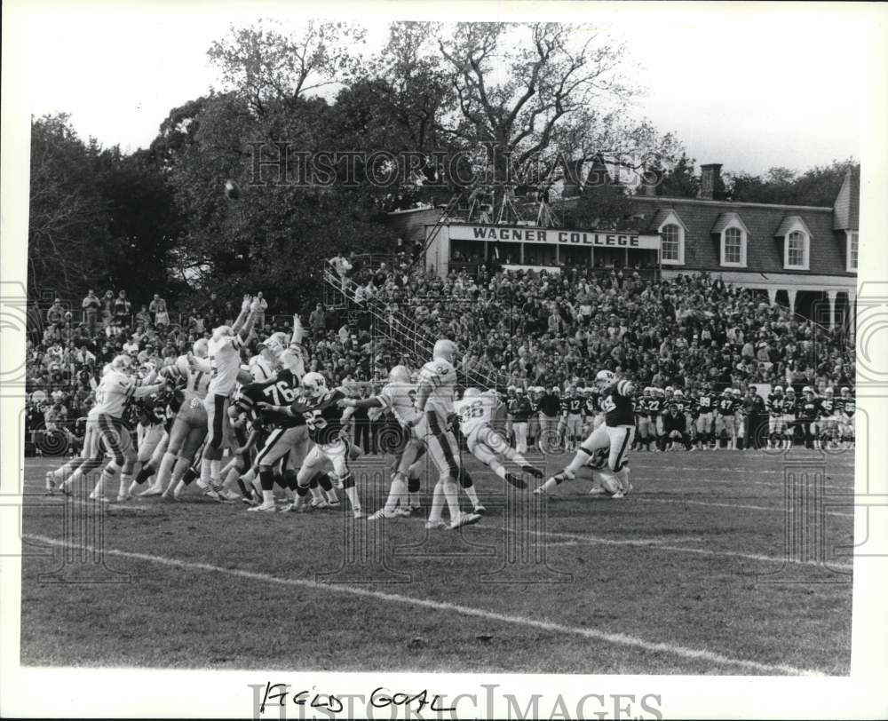 Press Photo Opposing team tries to block Wagner football kicker&#39;s field goal - Historic Images