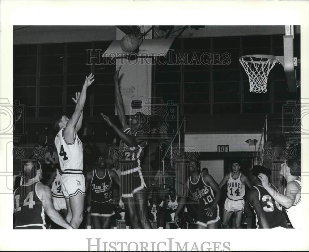 Press Photo Wagner basketball's #44 shooting over New York's #21 - Historic Images