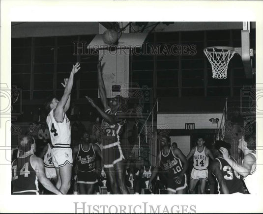 Press Photo Wagner basketball's #44 shooting over New York's #21