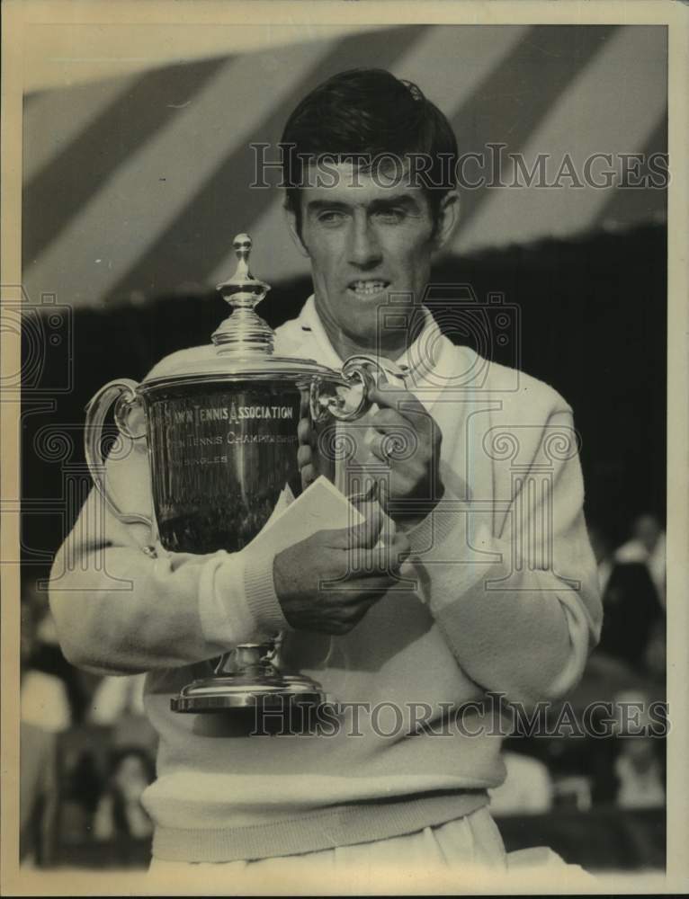 Press Photo Tennis champion Ken Rosewall holds a trophy - sis00315 - Historic Images