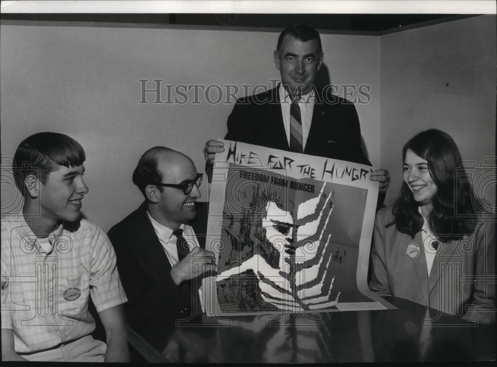 1969 Jerry N. Fletcher of First National Bank holds sigh for hike