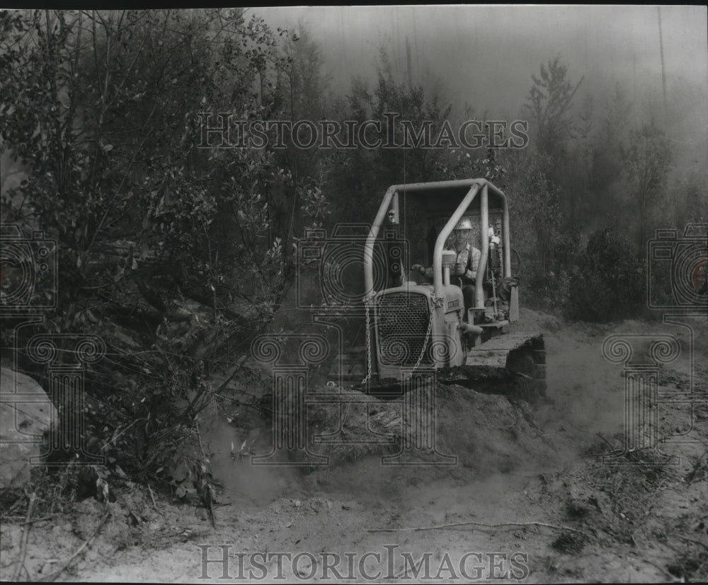 1967 Loren MacDonald man a bulldozer to maintain forest line - Historic Images