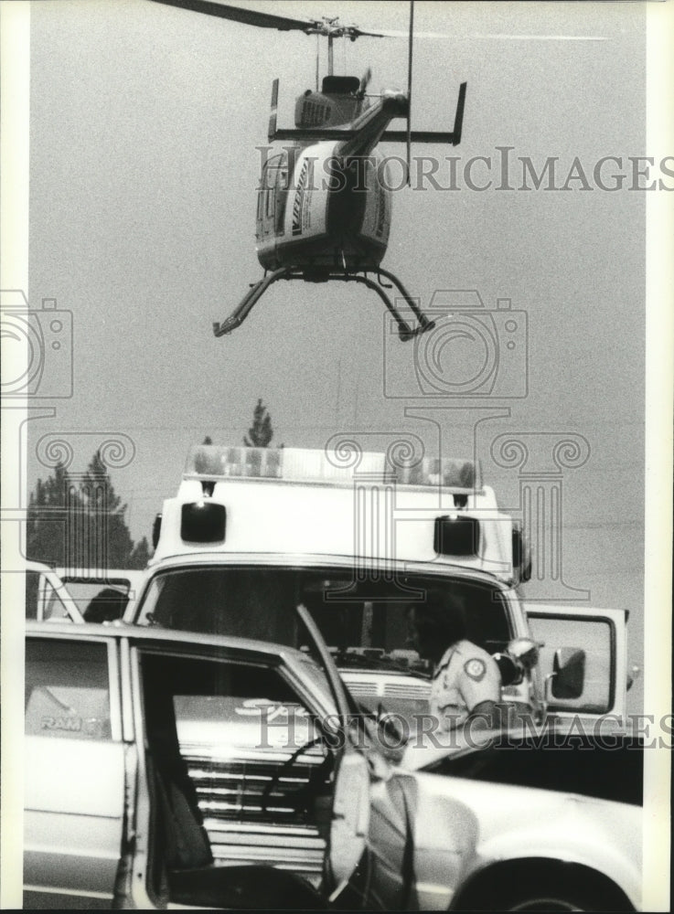 1984 Press Photo First responders in ambulance and helicopter. - spa55408 - Historic Images