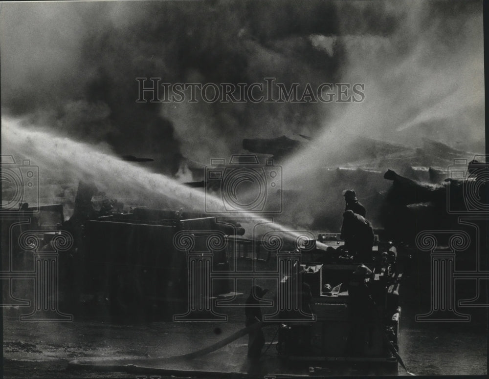 1984 Press Photo Firefighters work to extinguish fire in Post Falls, Idaho. - Historic Images