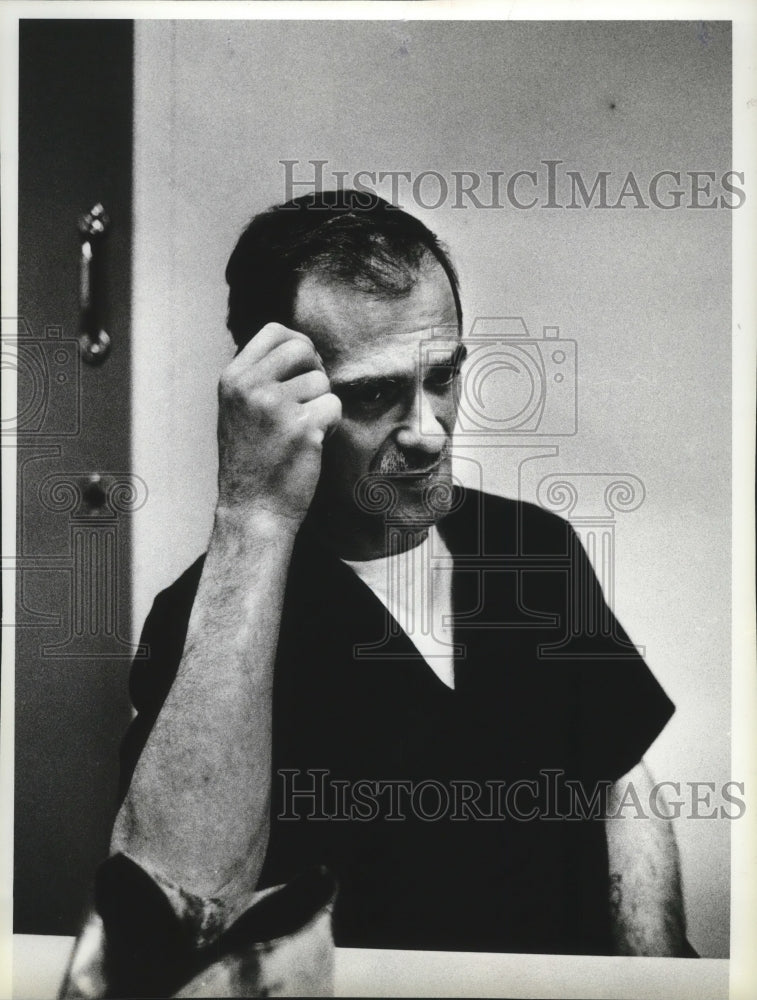 1984 Press Photo Max Olaf Larson in police custody for Robbery - spa61544 - Historic Images