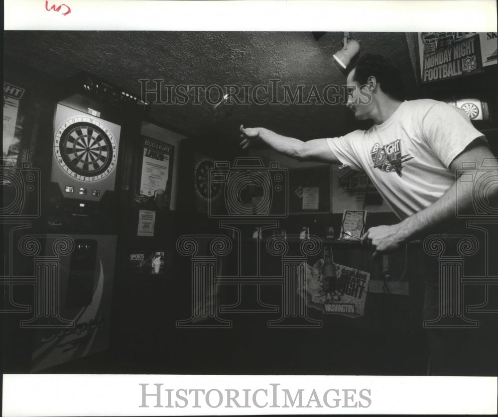 1992 Gary Knapp plays electronic darts at Ichabod's-competition game-Historic Images