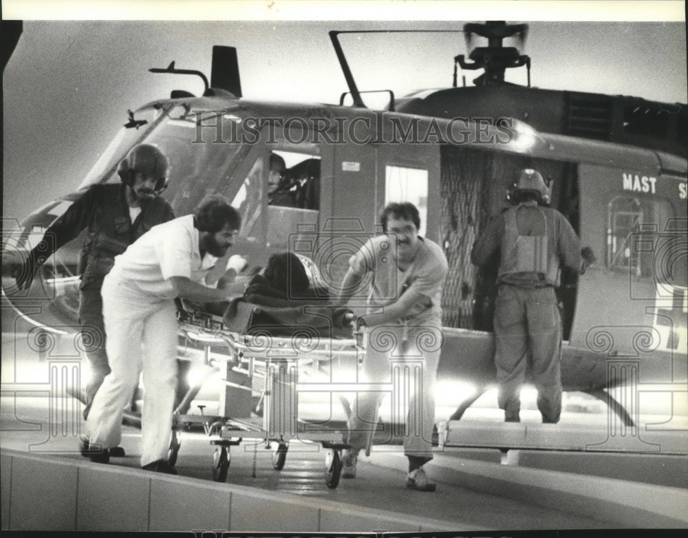 1979 Charles Dietz,injured survivor arrives Sacred Heart Hospital-Historic Images