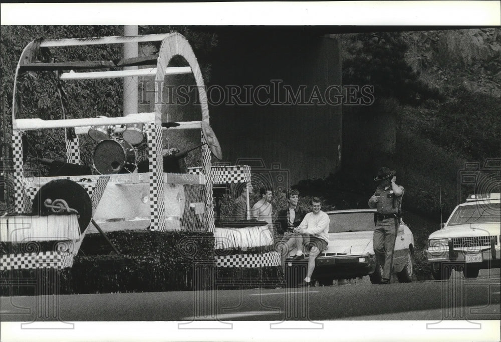 1991 Lilac Day float on Interstate 90 pulled over by Police officer-Historic Images