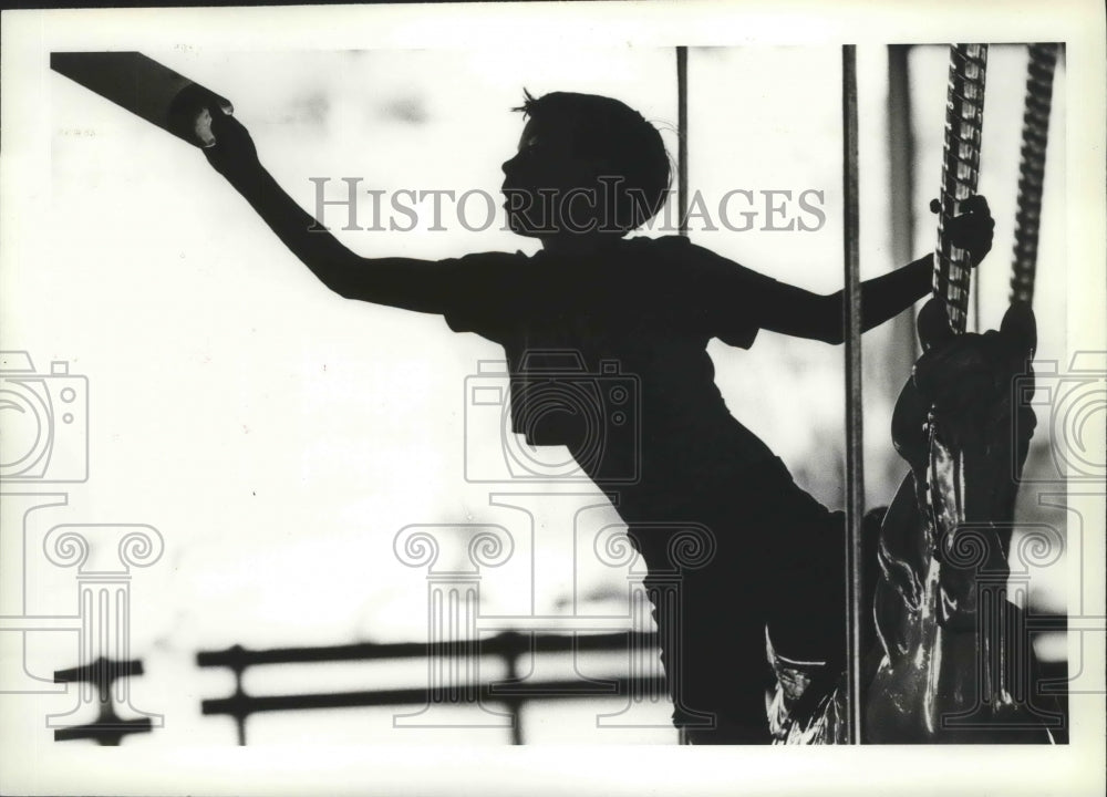 1984 Press Photo A child enjoying his Mary-Go-Round ride - spa77710 - Historic Images
