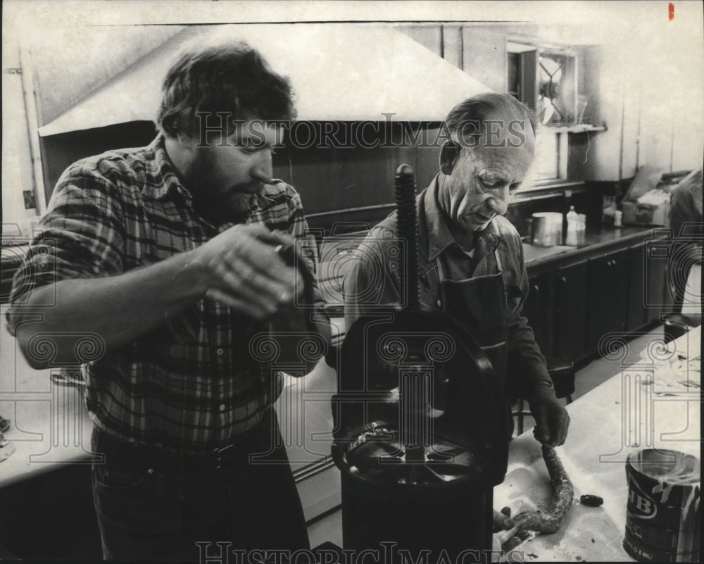 1980 Mike Faerber grinding sausage at Uniontown Historic Images