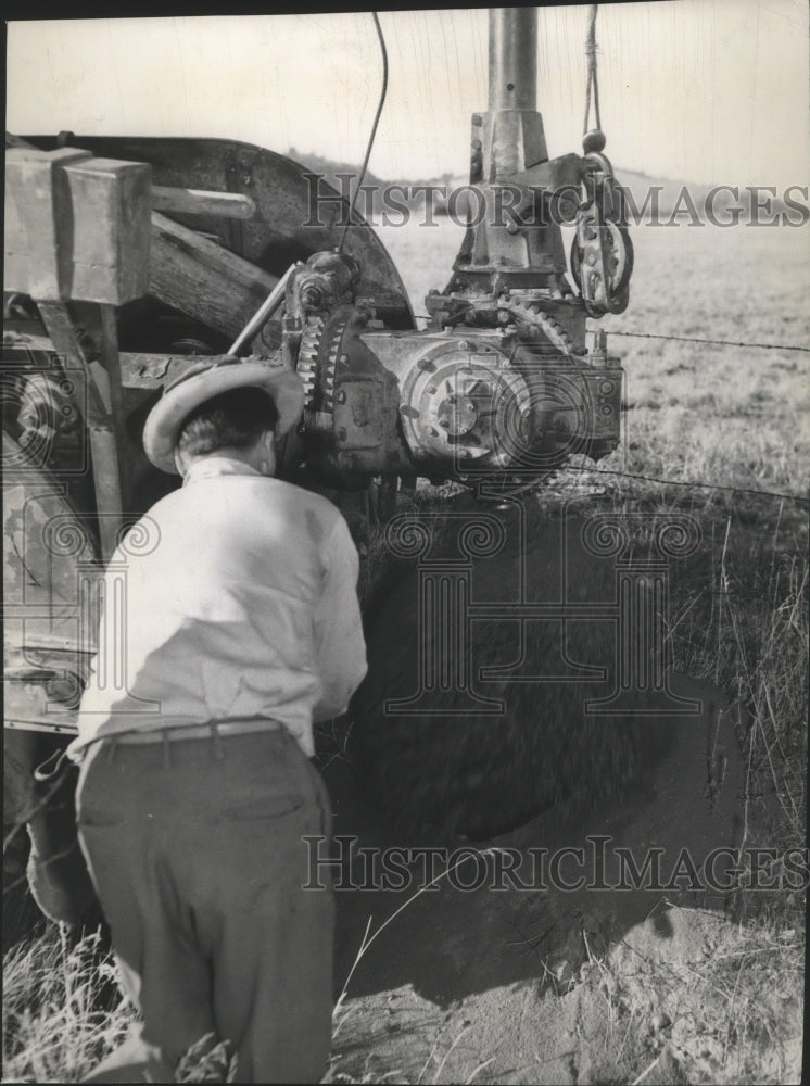 Press Photo Tractor digging hole for Pacific Northwest Telephone Company - Historic Images
