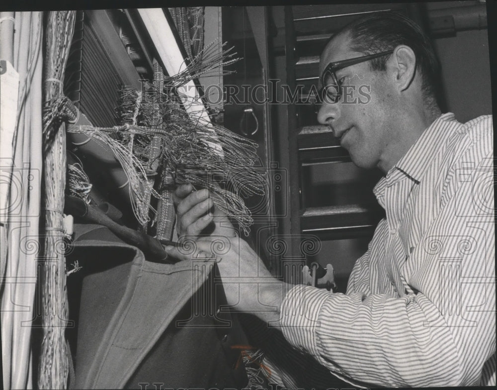 1965 Press Photo Man working on wires for Pacific Northwest Telephone Historic Images