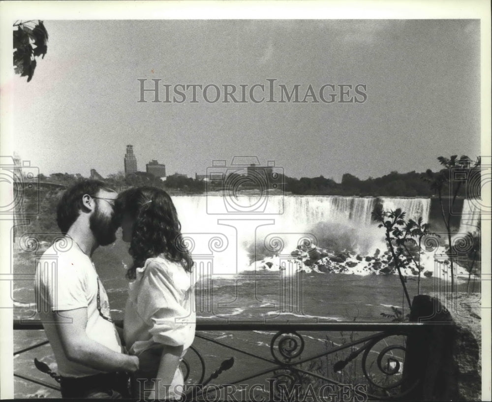 1984 Couple kissing in front of Niagara Falls , New York-Historic Images