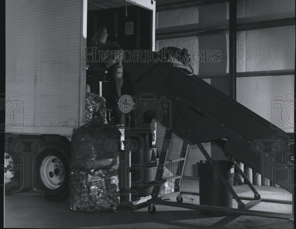 1975 Unloading a truck at Reynolds Recycling Center-Historic Images
