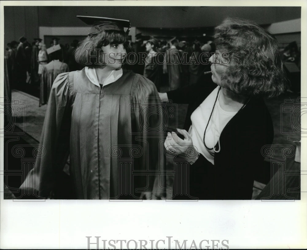 1989 Ferris high grad Jodi Bender gets a hairpin from Mary Robinson-Historic Images