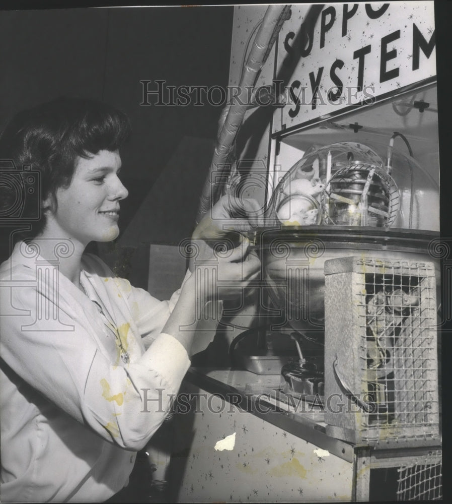 1965 Scientists-A young scientist fixes her experiment - Historic Images