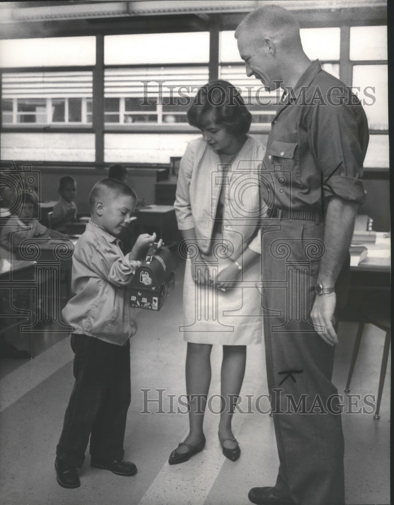 Valley Elementary student shows his lunch bag-Historic Images