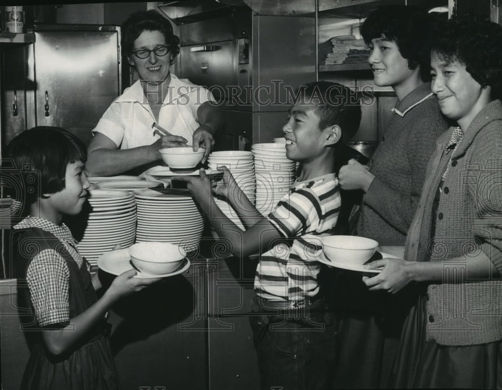 1963 Four Hong Kong Chinese pupils at Finch School's cafeteria